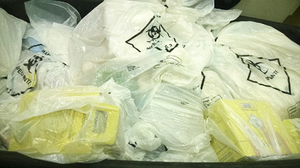 Medical waste collection in bags and sharp boxes