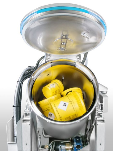 Treatment of medical hazardous waste with steam sterilization and shredding in a single vessel